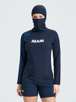 A person wears the SLAM OD WS TECH HOODED T-SHIRT in navy blue, made from recycled stretch fabric, paired with shorts and a swim cap with face covering. 