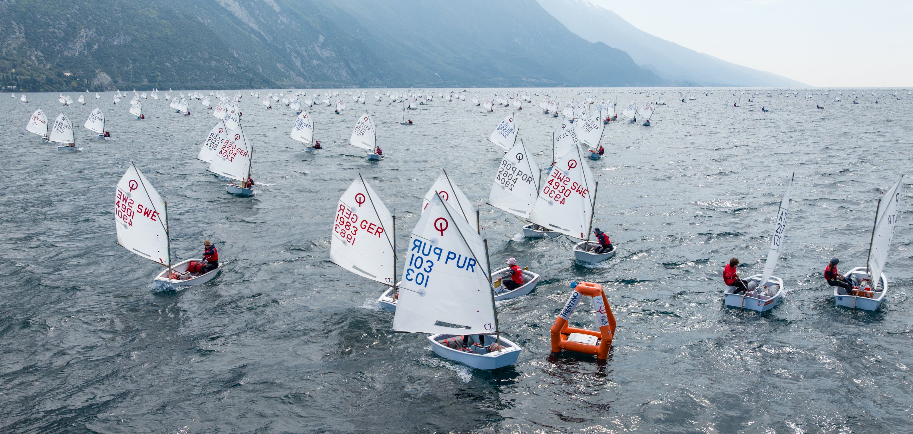 Kids competing on the Optimist Meeting on Lake Garda
